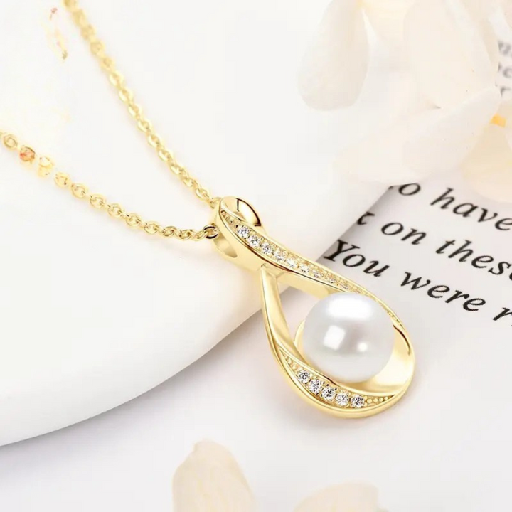 Golden infinity pendant with freshwater pearl