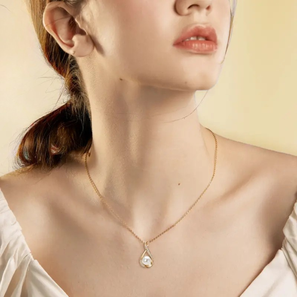 Golden infinity pendant with freshwater pearl