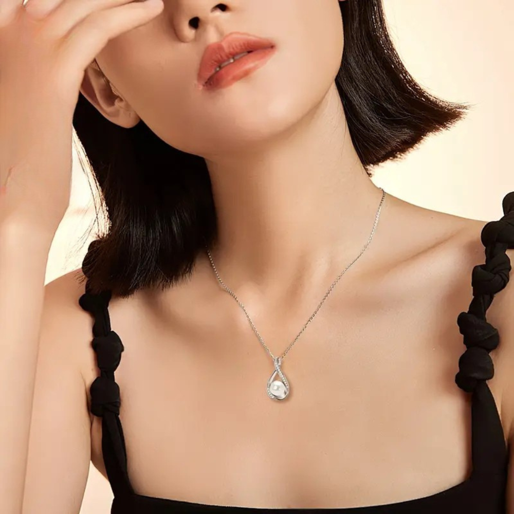 Golden infinity pendant with freshwater pearl